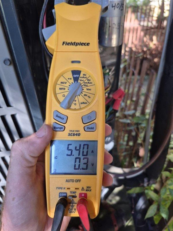 Performed comprehensive heating system maintenance check on outdoor HVAC unit. Conducted electrical diagnostics using digital multimeter, measuring amp draw of 5.40A and verifying voltage readings at control board terminals. Inspected all electrical connections, terminal blocks, and wiring within control panel, confirming proper operation of heating components. System operating within normal parameters with no issues identified.