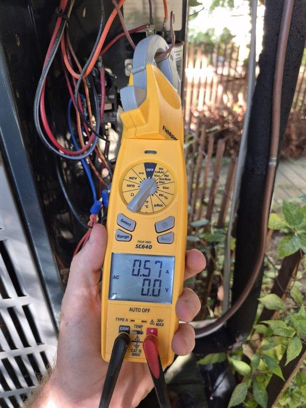 Performed comprehensive heating system maintenance check on outdoor HVAC unit. Conducted electrical diagnostics using digital multimeter, measuring amp draw of 5.40A and verifying voltage readings at control board terminals. Inspected all electrical connections, terminal blocks, and wiring within control panel, confirming proper operation of heating components. System operating within normal parameters with no issues identified.