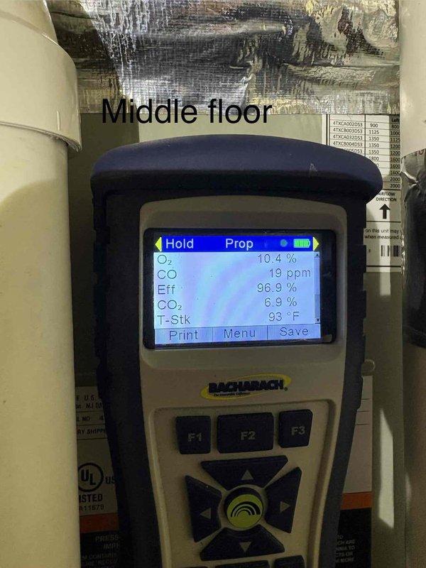 Performed comprehensive tune-up and inspection on three HVAC systems. Conducted combustion analysis testing on downstairs and middle floor units using digital analyzer, confirming optimal efficiency readings of 96.1% and 96.9% respectively, with safe CO levels at 17 ppm and 19 ppm, and proper oxygen levels around 10.3-10.4%. All systems operating within manufacturer specifications.