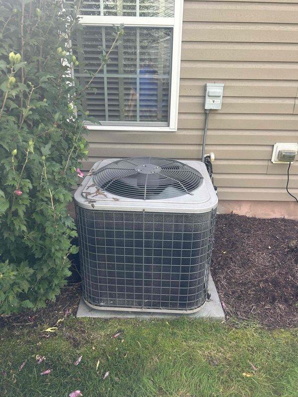 Responded to no cooling call on residential split system. Upon arrival, found outdoor condenser unit operational but system not achieving setpoint with indoor temperature rising. Performed diagnostics including refrigerant charge verification, measuring superheat at 150°F and subcooling at 15% below target parameters. System was shut down to prevent compressor damage. Inspected attic-mounted air handler and ductwork for airflow restrictions or equipment malfunctions. Documented equipment conditions with photos showing outdoor unit placement and attic installation configuration for further assessment and repair recommendations.