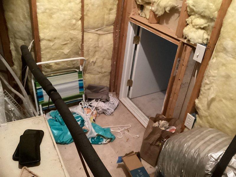 Responded to emergency service call for non-cooling AC system with depleted R22 refrigerant. Conducted on-site assessment and obtained measurements for complete HVAC system replacement in residential property. Documented existing horizontal air handler installation in basement mechanical space with flexible ductwork configuration and photographed equipment specifications to prepare replacement estimate for obsolete R22 system.
