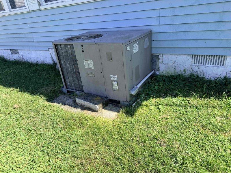 Conducted on-site evaluation of existing packaged HVAC unit for replacement estimate. Inspected outdoor equipment condition, documented current Honeywell digital thermostat operation, and assessed system specifications to provide comprehensive replacement recommendations for aging package unit.