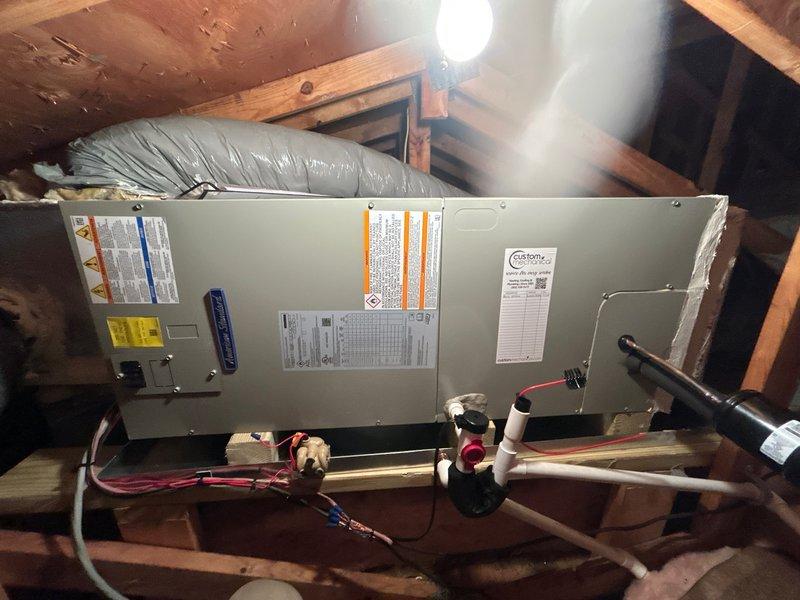 Completed full HVAC system replacement at residential property for new customer. Removed and disposed of existing equipment. Installed 5A6H7024 2-ton 17 SEER heat pump outdoor unit on risers on existing pad. Installed 5TEM6B02 variable speed fan coil unit in attic with drain pan and shut-off valve. Mounted BAYHTR1410BRKR 10KW electric heater with breaker to air handler. Flushed, pressure tested, and recharged refrigerant lines. Sealed all supply and return duct connections with mastic to minimize air leakage. Installed surge disconnect and electrical whip to outdoor unit. Installed THX1200W WiFi thermostat for system control. All equipment tested and operational. System includes one-year parts and labor warranty coverage.