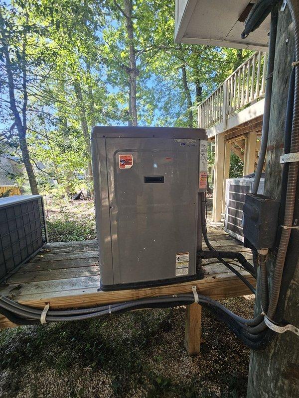 Completed comprehensive tune-up and inspection of residential HVAC system located on exterior wooden platform beneath elevated deck structure. Performed standard maintenance procedures including inspection of outdoor condensing unit, refrigerant line set, electrical connections, and ductwork routing. System found to be operating within normal parameters with no immediate repairs required at time of service.