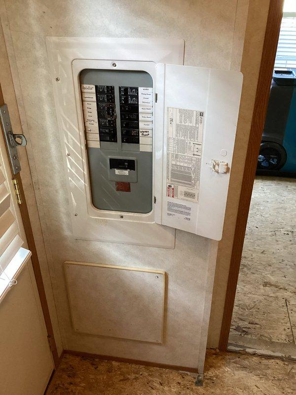 Responded to service call to reattach A.O. Smith Q150 water heater that had become disconnected from its mounting system. Upon arrival, accessed the mechanical closet and secured the water heater unit back into proper position within the wooden-framed alcove. Verified all plumbing connections including copper water supply lines with shutoff valves, yellow flexible gas line, and bottom discharge piping remained intact and properly sealed. Confirmed electrical connection at breaker panel remained secure with no tripped breakers. Tested unit operation and verified no leaks at connections. Left water heater fully operational and properly mounted.