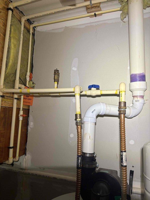 Completed scheduled cooling maintenance visit as part of recurring service agreement. Upon arrival, customer requested rescheduling of appointment, which was accommodated for a later date. Documented existing plumbing infrastructure and water heater installation in utility area, including Bradford White water heater with proper safety labeling and flexible gas line connection. All mechanical systems and utility connections photographed for service records.