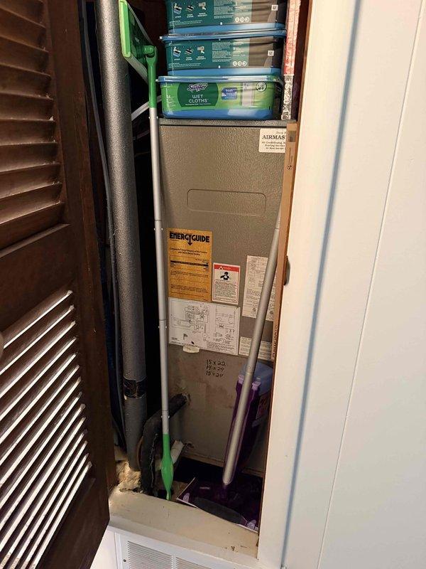 Conducted on-site evaluation for HVAC system replacement in multi-unit condo building where structural work necessitates equipment upgrades. Assessed two identical aging systems located in narrow hallway closets requiring full replacement, and evaluated two additional units that may need temporary disconnection and removal to facilitate foundation piling replacement work beneath the building. Documented existing installations including indoor furnace units in confined utility spaces and outdoor condensing units mounted on cemented stands, photographed equipment conditions and spatial constraints, and provided comprehensive replacement estimate addressing both immediate replacement needs for deteriorated units and contingency planning for temporary system removal during structural repairs.
