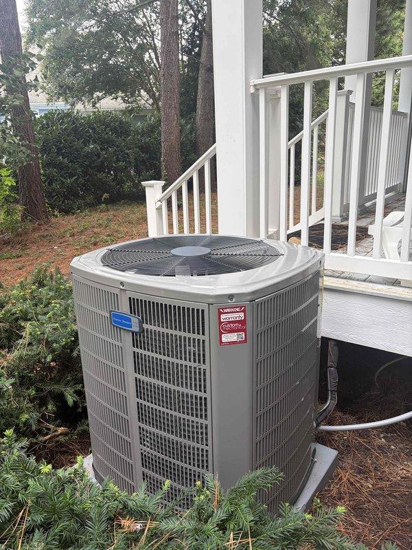 Completed full HVAC system replacement including removal and disposal of existing equipment. Installed 4-ton 17 SEER heat pump outdoor unit on platform with new 5A6H7048 condenser, 5TEM6D06 variable speed fan coil unit positioned in drain pan with shutoff valve, 15KW electric heat kit with breaker, 1-inch filter rack, and WiFi-enabled thermostat. Furnished and installed electrical disconnect, whip connection, and surge protection for outdoor unit. Flushed refrigeration lines, performed pressure testing to verify system integrity, and recharged system to manufacturer specifications. All equipment operational and system includes one-year warranty extension.