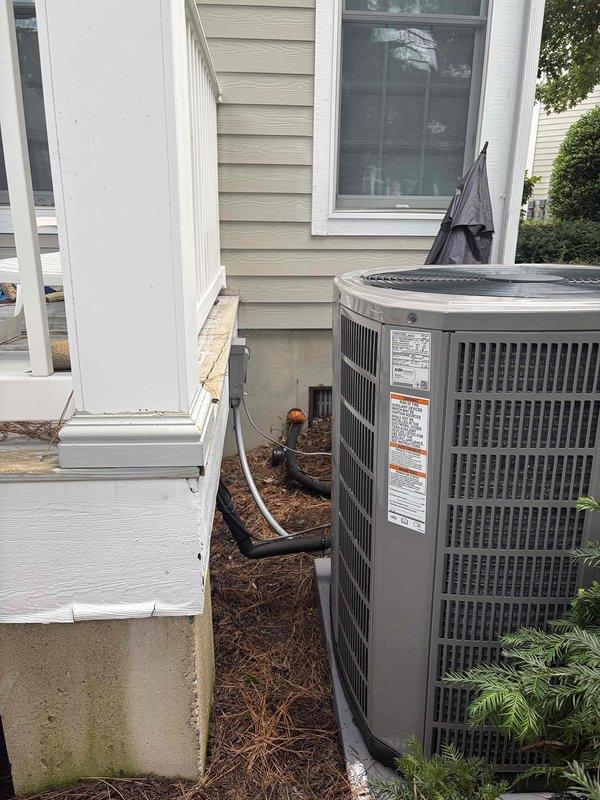 Completed full HVAC system replacement including removal and disposal of existing equipment. Installed 4-ton 17 SEER heat pump outdoor unit on platform with new 5A6H7048 condenser, 5TEM6D06 variable speed fan coil unit positioned in drain pan with shutoff valve, 15KW electric heat kit with breaker, 1-inch filter rack, and WiFi-enabled thermostat. Furnished and installed electrical disconnect, whip connection, and surge protection for outdoor unit. Flushed refrigeration lines, performed pressure testing to verify system integrity, and recharged system to manufacturer specifications. All equipment operational and system includes one-year warranty extension.