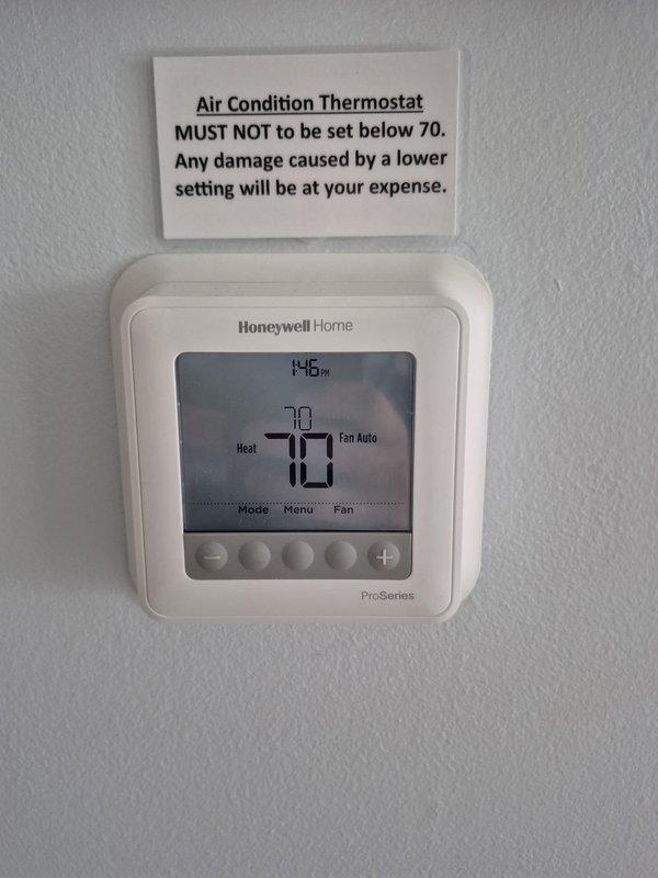 Completed recurring heating maintenance visit and system diagnostics. Verified thermostat operation showing proper heating mode at 70°F setpoint with fan in auto mode. Performed electrical measurements at the system panel using clamp meter, recording amperage draw of 37.49A with minimal variance, confirming normal operating parameters for the heating equipment.
