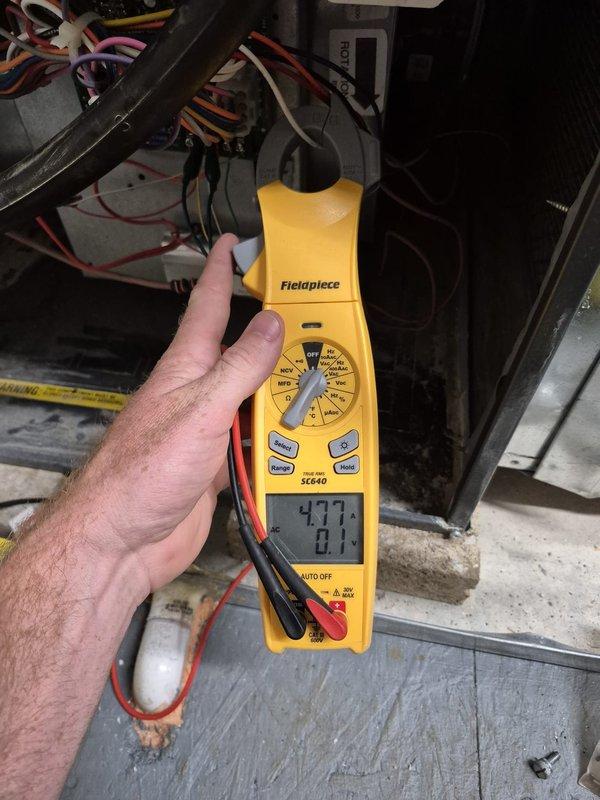 Performed comprehensive heating system maintenance and combustion analysis on natural gas furnace. Verified electrical components using clamp meter and conducted full combustion efficiency testing, recording CO₂ levels, oxygen content at 7.6%, stack temperature at 120°F, and ambient temperature at 75.8°F with CO readings at 48.5 ppm, confirming safe and efficient operation within manufacturer specifications.