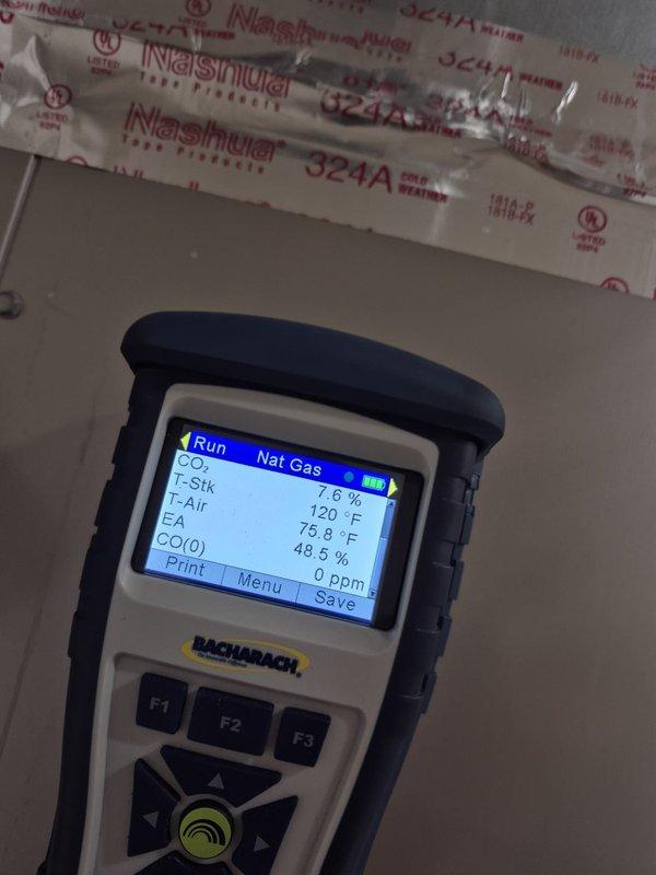 Performed comprehensive heating system maintenance and combustion analysis on natural gas furnace. Verified electrical components using clamp meter and conducted full combustion efficiency testing, recording CO₂ levels, oxygen content at 7.6%, stack temperature at 120°F, and ambient temperature at 75.8°F with CO readings at 48.5 ppm, confirming safe and efficient operation within manufacturer specifications.