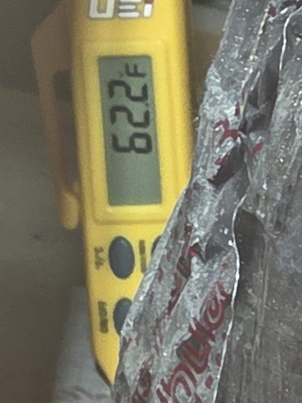 Responded to emergency no-cool call for top floor air conditioning unit. Upon inspection, measured supply air temperature at 62.2°F and return air temperature at 80.1°F at the attic ductwork, confirming system was producing adequate temperature differential of approximately 18°F and operating within normal parameters. Verified proper airflow and system function, determined unit was cooling effectively despite customer concern.