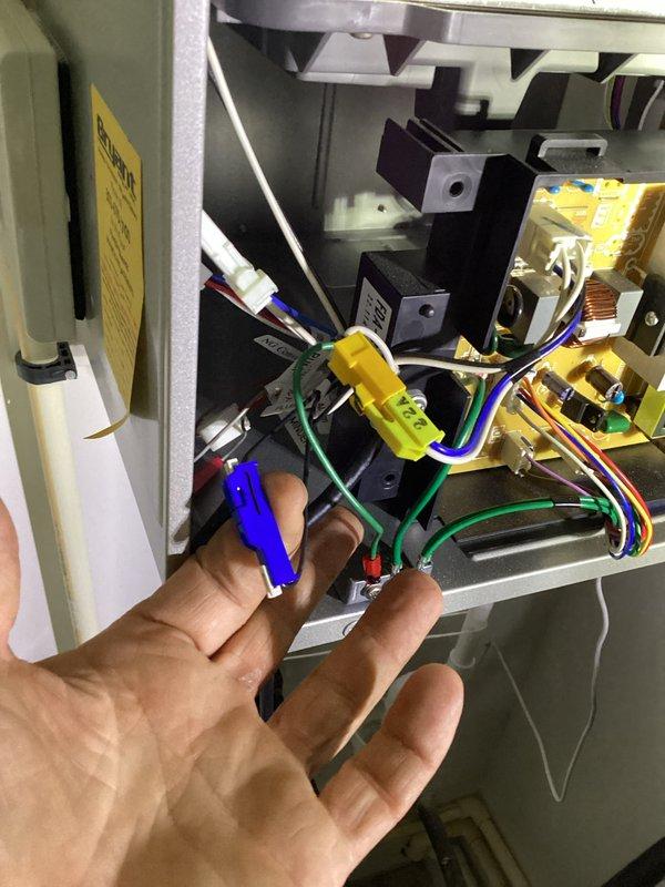 Completed recurring maintenance visit on tankless water heater system. Performed comprehensive inspection of unit controls, verified proper operation with digital display reading 53°F and confirming priority burner status. Accessed internal electrical components, inspected wiring connections including terminal blocks and multi-colored wire harnesses, and verified all connections were secure and functioning properly.