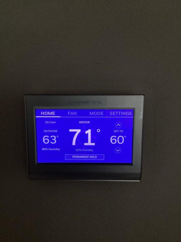 Responded to service call for HVAC system seasonal changeover. Upon arrival, accessed ceiling-mounted duct damper system and manually switched damper positions from cooling mode to heating mode per homeowner's request. Verified Honeywell Home smart thermostat was functioning properly and displaying correct temperature readings. System ready for heating season operation.