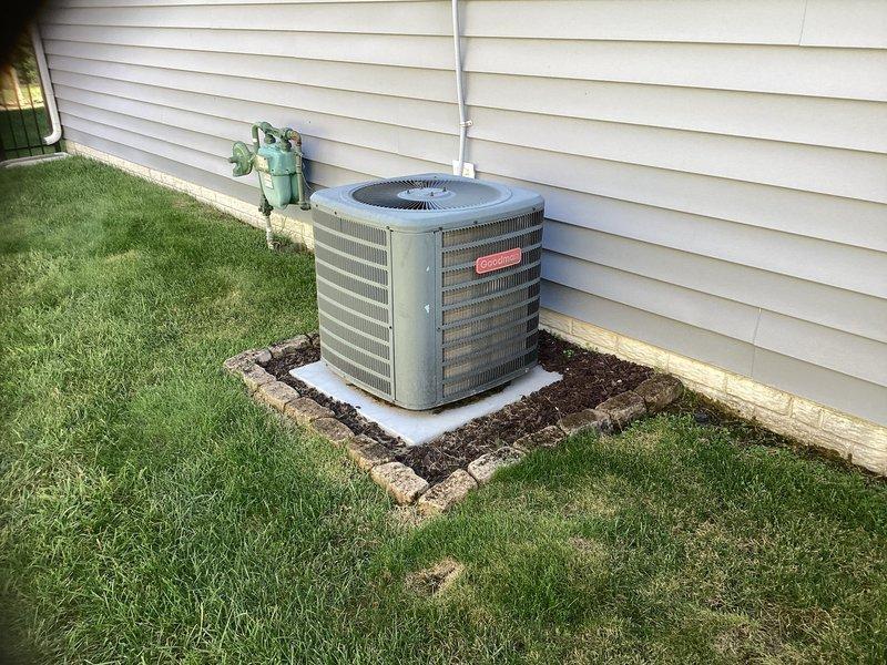 Conducted estimate for complete HVAC system replacement for unit located in garage attic space. Existing system is approximately 10 years old and currently operational. Assessed attic access via pull-down ladder, evaluated outdoor condensing unit positioned on concrete pad with proper landscaping clearance, and documented refrigerant line routing along exterior siding. Provided replacement recommendations for aging equipment approaching end of expected service life.