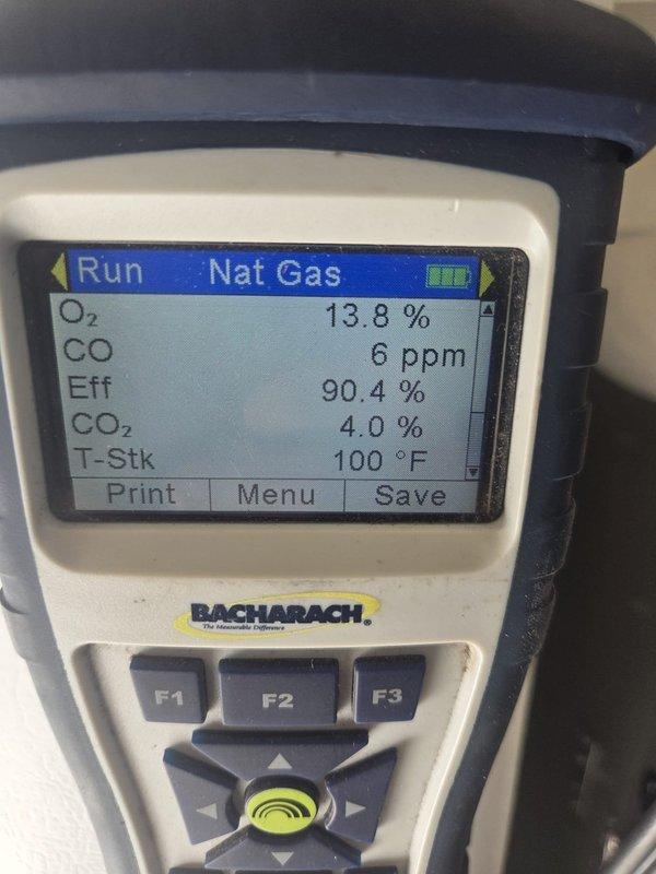 Performed routine heating maintenance visit on natural gas heating system. Conducted combustion analysis using digital analyzer, which confirmed optimal system performance with 90.4% efficiency, 6 ppm carbon monoxide, 13.8% oxygen, 4.0% carbon dioxide, and 100°F stack temperature. Inspected PVC vent piping configuration in attic space, verifying proper installation and secure connections of all elbows and straight sections. All components found in good working condition with no issues requiring correction.