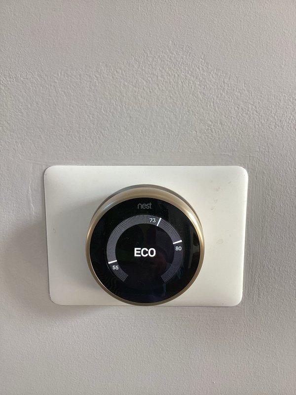 Responded to water leak complaint in upstairs closet suspected to be related to HVAC condensate drainage. Upon inspection, verified thermostat operation showing ECO mode and examined potential condensate line penetration point through ceiling. Documented system conditions with photos for further evaluation of drainage pathway and potential condensate backup issues.