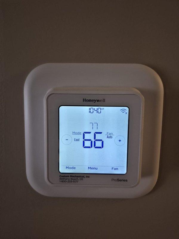 Completed scheduled heating maintenance visit at property with key access. Verified Honeywell ProSeries WiFi thermostat operation and confirmed proper temperature control functionality, with system maintaining programmed setpoints and displaying correct readings throughout inspection.