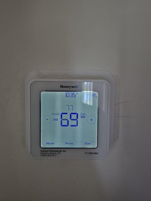 Completed scheduled heating maintenance visit at property with key access. Verified Honeywell ProSeries WiFi thermostat operation and confirmed proper temperature control functionality, with system maintaining programmed setpoints and displaying correct readings throughout inspection.