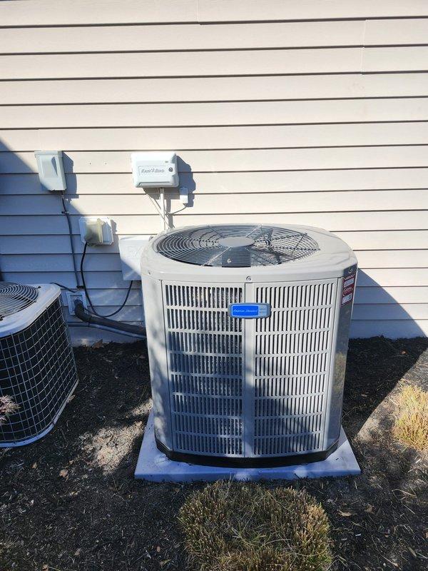 Removed and disposed of existing HVAC system and completed full installation of American Standard equipment including S9X1B080U4PSB 95% efficiency gas furnace with ECM blower, 5A7A4042A1000 3.5-ton 14 SEER air conditioning condenser, and 5TXCB006AS3HC evaporator coil. Installed LP conversion kit to adapt furnace for propane fuel. Fabricated and installed metal duct transitions to integrate new equipment with existing ductwork. Reused existing refrigeration lines and condensate drainage system. Replaced outdoor electrical disconnect and whip to meet current code requirements. Mounted outdoor condenser unit on plastic pad as specified. Installed Honeywell 1C1006K zone control board to manage dual-zone operation. Mounted two Honeywell standard thermostats for independent zone control. Installed filter grilles with (2) 14x14x1 and (1) 20x20x1 filters at return air locations. Verified all electrical connections and tested system operation. Measured draft pressure at 11.11 inches water colum