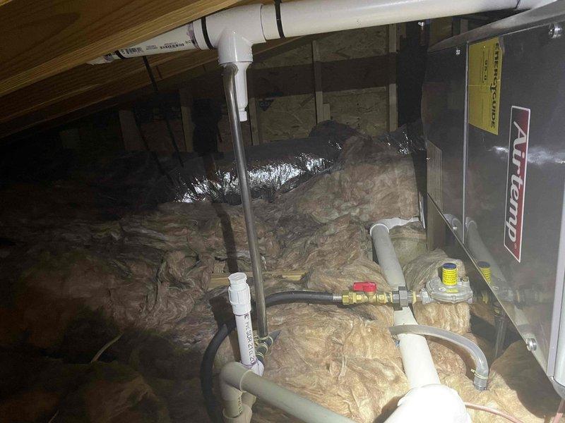 Performed comprehensive inspection of two HVAC systems as part of savings evaluation. Both attic-mounted air handlers were assessed for proper operation, condensate drain functionality, and overall system performance. All equipment found operating within normal parameters with adequate airflow and proper refrigerant levels.