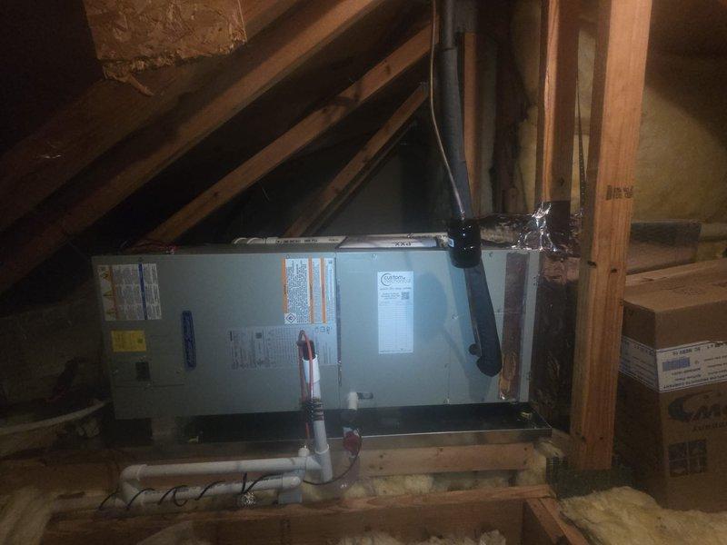 Removed and disposed of the existing equipment and installed a new American Standard 2-ton 14 SEER heat pump with matching air handler, 10 kW electric heat package, filter rack, and Honeywell WiFi thermostat. Fabricated and installed metal duct transitions to adapt to the existing ductwork, replaced the outdoor disconnect and electrical whip, and reused the existing electrical, condensate, and power lines. Replaced the drain pan and float switch, and set the outdoor unit on a plastic pad with snow legs.
