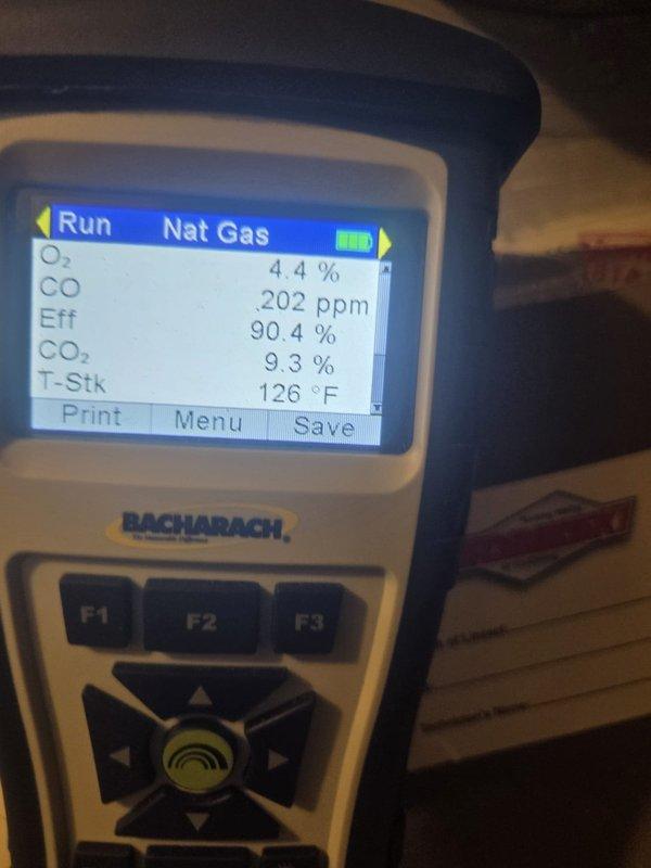 Performed seasonal heating maintenance on the natural gas furnace, including inspection of the ductwork, damper actuators, condensate/PVC venting, and electrical connections. Conducted a combustion analysis with a Bacharach analyzer, recording 4.4% O₂, 9.3% CO₂, 90.4% efficiency, and 126°F stack temperature, with CO within acceptable limits. The system was found to be operating properly, with no visible signs of rust, cracking, or ice.