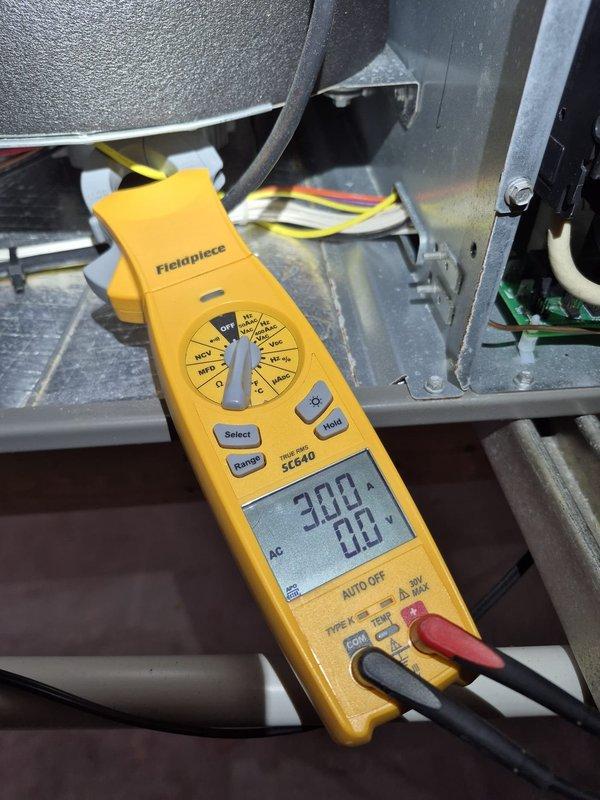 Performed a scheduled heating system inspection and verified operation of the furnace/air handler electrical components. Measured amperage draw with a true RMS clamp meter (readings of approximately 3.0 A and 6.87 A on the monitored circuits), and visually inspected the capacitor, control board, relays, and wiring connections, finding no signs of damage, corrosion, or overheating. System was left operating normally with thermostat set to 68°F.