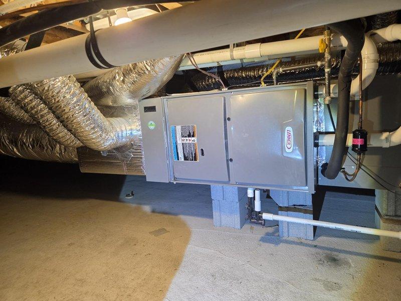 Performed an IAQ estimate for installation of a crawl space dehumidifier in a roughly 3-year-old home with no existing unit. Inspected the horizontally mounted Lennox air handler, insulated flex ductwork, foil-wrapped plenum, refrigerant lines, and PVC condensate drain, and found no visible frost, rust, or damage. Reviewed crawl space dehumidification and whole-home air purification options, including solutions comparable to the customer's current APCO RT system, to support a proposal.