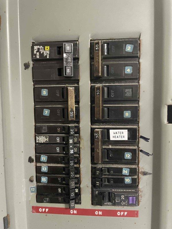 Performed a tune-up inspection on one HVAC system, including a heating and cooling operational check. Verified thermostat functionality, with the system responding properly in cooling mode and maintaining setpoint, and inspected the electrical service panel and breakers serving the equipment. Noted dust buildup, corrosion at the panel cover and screw heads, and loose hardware at the panel, which may warrant further evaluation.
