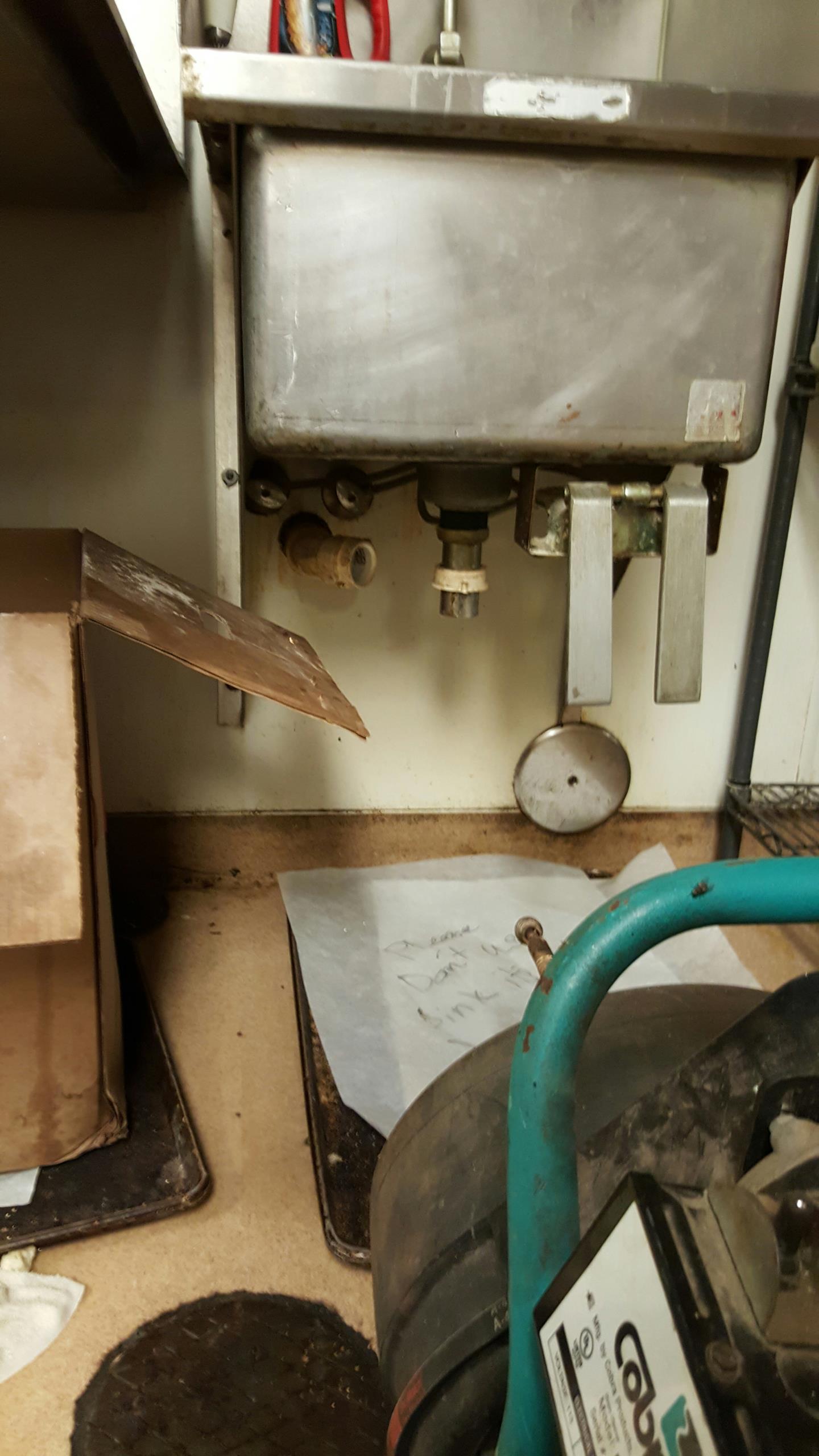 Cleaning out a clogged sink line