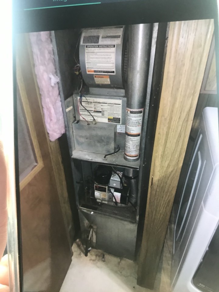 Replacing old oil furnace in a manufactured home and installing a new high efficient propane furnace and air conditioner