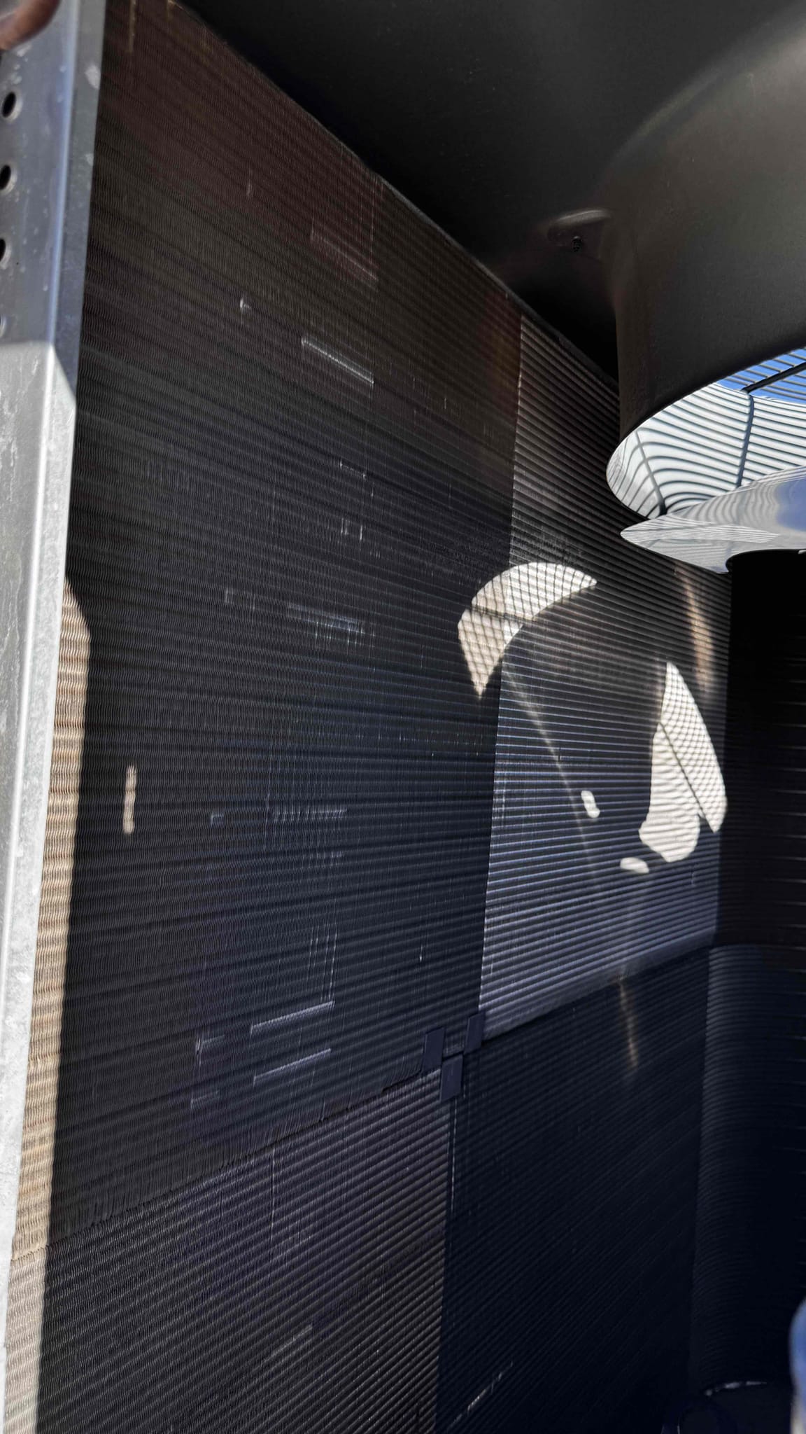 During the inspection, I identified that the blower wheel was accumulating dust and debris, which could affect the efficiency of the system. I carefully examined the wheel and found that it was clogged, leading to reduced airflow. To address this, I cleaned the blower wheel thoroughly, removing all accumulated dust and debris. This process involved disassembling the necessary components, cleaning each part meticulously, and ensuring that the wheel spun freely without obstruction. After reassembling, I tested the system to confirm that the airflow had improved significantly. This maintenance will help ensure the system operates efficiently and prolong its lifespan.