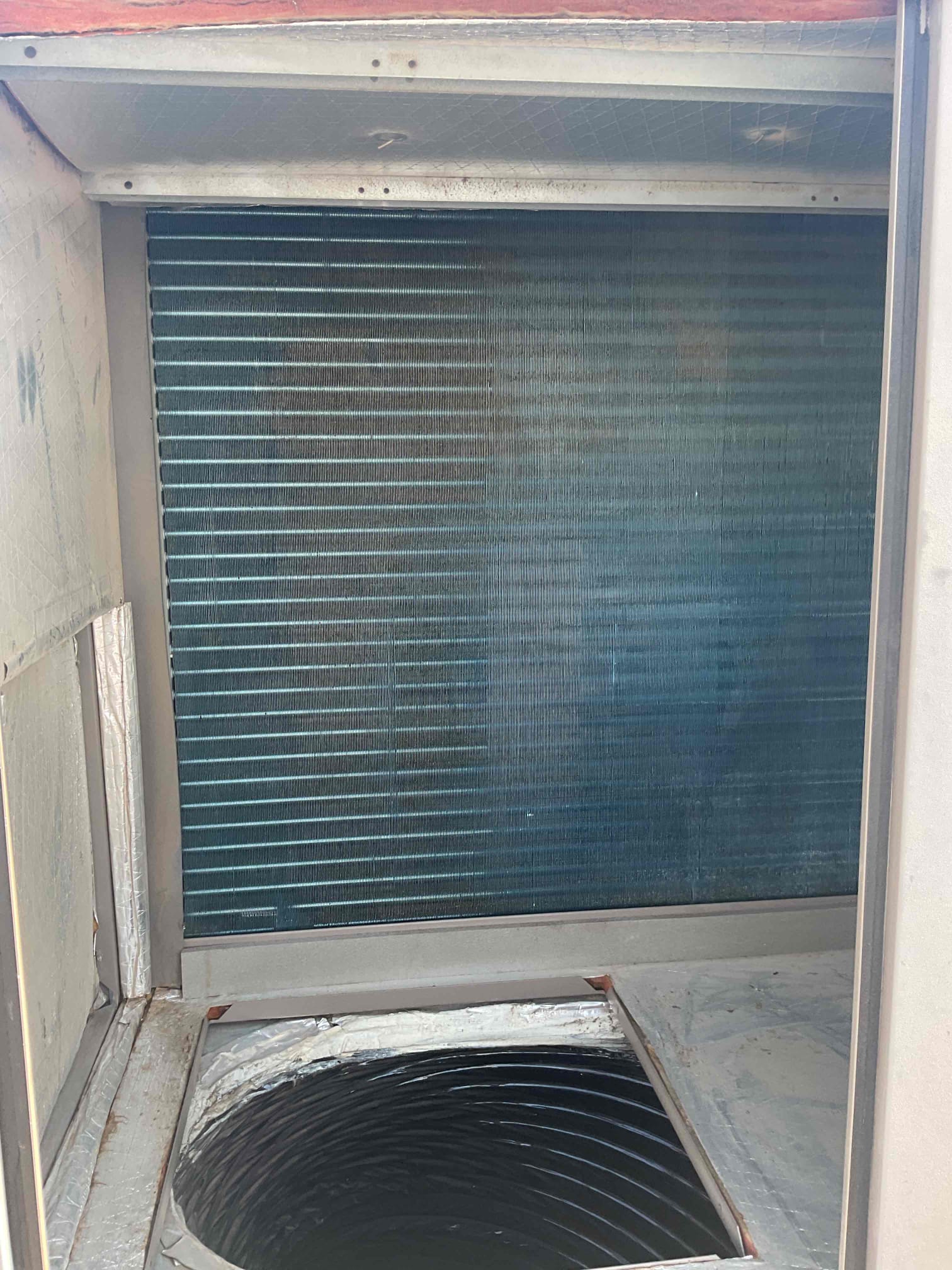 During the recent maintenance, the machine was thoroughly inspected and found to be mechanically sound, with the exception of the voltage distribution. However, significant dust buildup on the blower wheel and unsealed ductwork in the attic raised concerns. The dust accumulation could potentially lead to future mechanical failures and compromised air quality. Additionally, the unsealed ductwork could allow contaminants to circulate throughout the system. To address these issues, the blower wheel was meticulously cleaned, and recommendations were provided for sealing the ductwork to enhance system efficiency and indoor air quality.