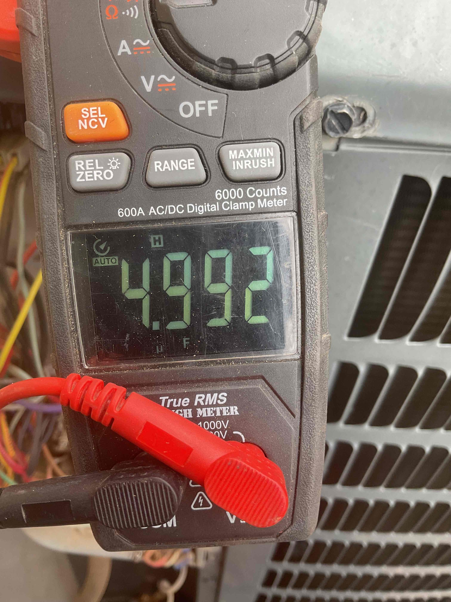 During the inspection, I identified several critical issues with the air conditioning system. The condenser was heavily soiled, which can significantly reduce efficiency. The blower wheel was also dirty, affecting airflow and overall performance. Additionally, there was no flood protection in place, which poses a risk of water damage. I discussed these findings with the client and their spouse, explaining the importance of addressing these issues promptly.