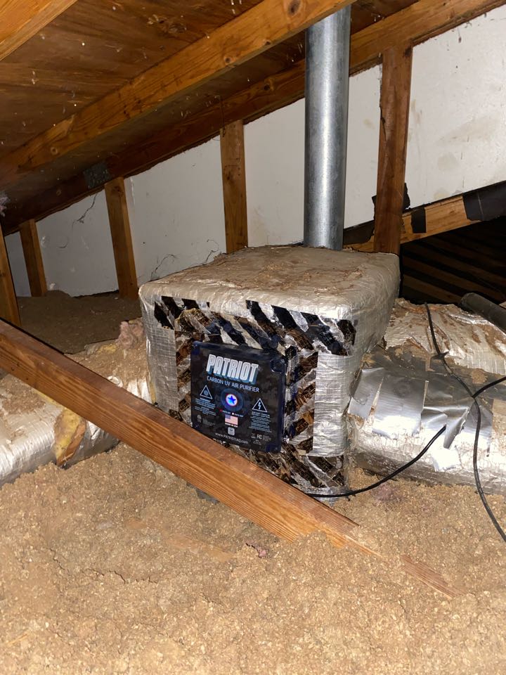 Installation of a Patriot whole home air purifier. 