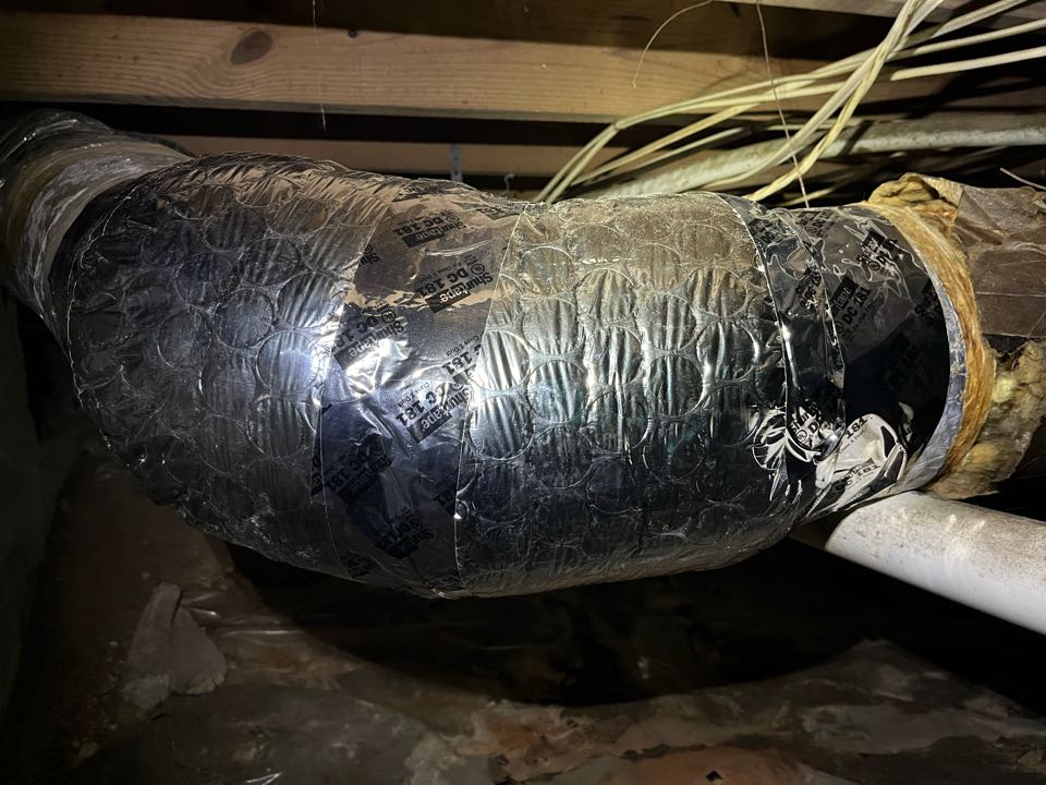 Ducane air conditioning spot wrap ductwork with new insulation where it’s needed. 