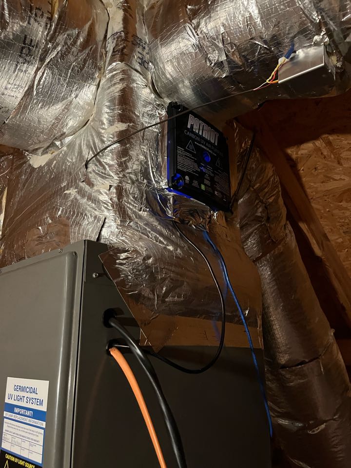 Rheem heat pump cleaning with a UV and Carbon Cell whole home air cleaner installation 
