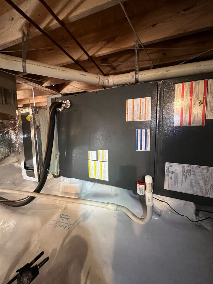 Goodman heat pump heating maintenance and condensate overflow installation. 