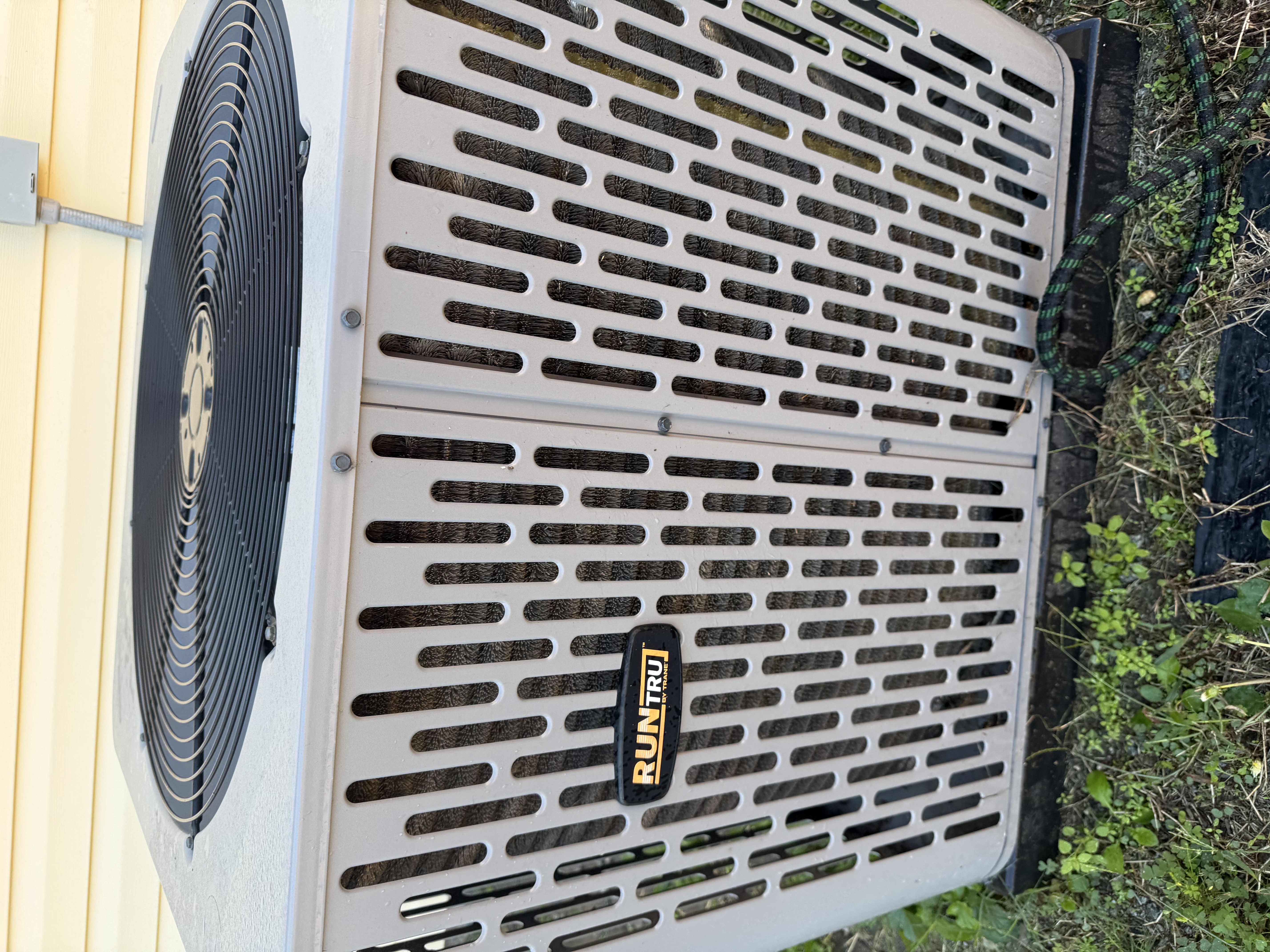 A/C maintenance on Trane airhandler and heat pump. Drain pan with minor rust. 