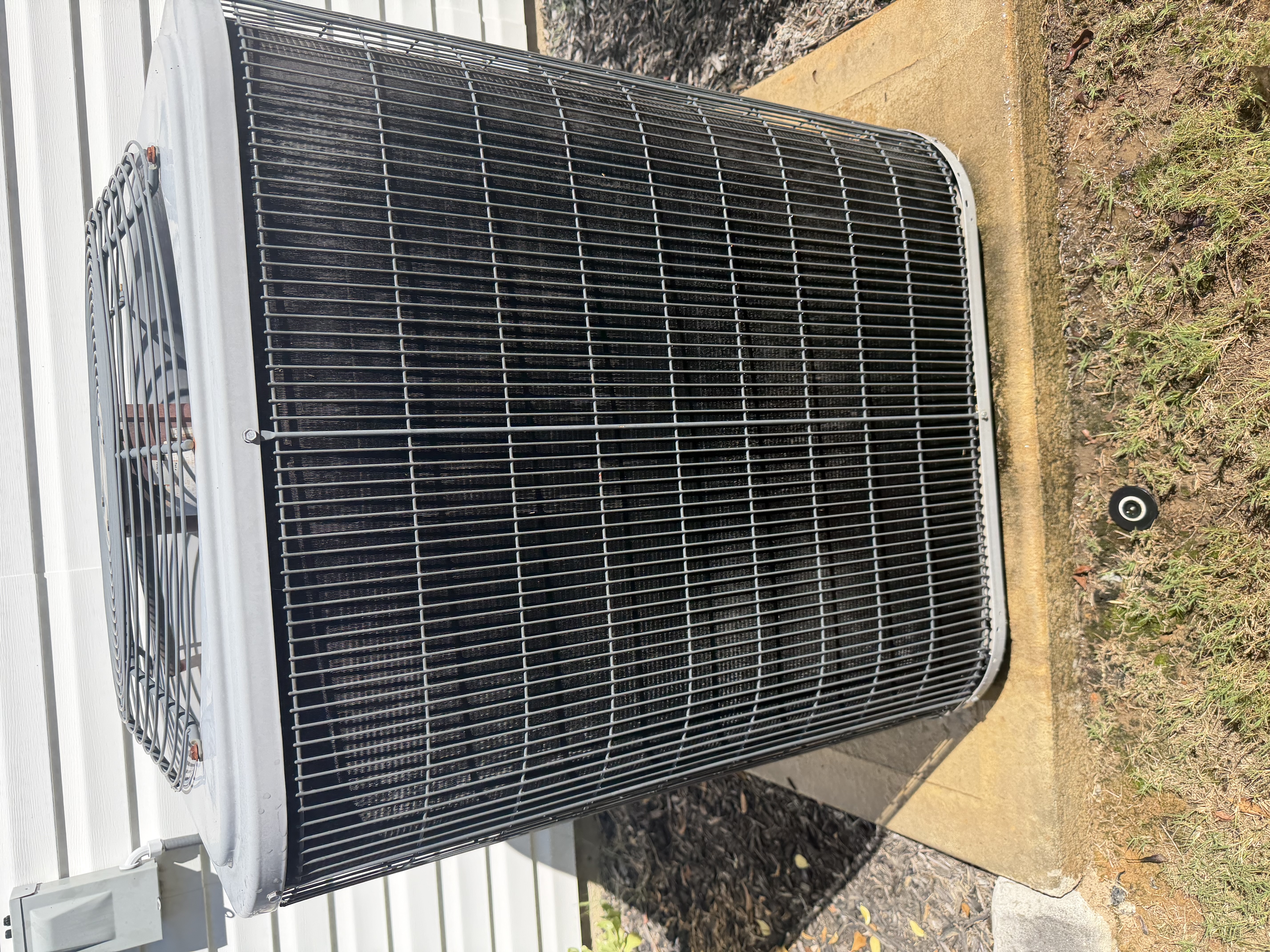 A/C maintenance on a carrier heat pump. Picture of cleaned condenser coils. 