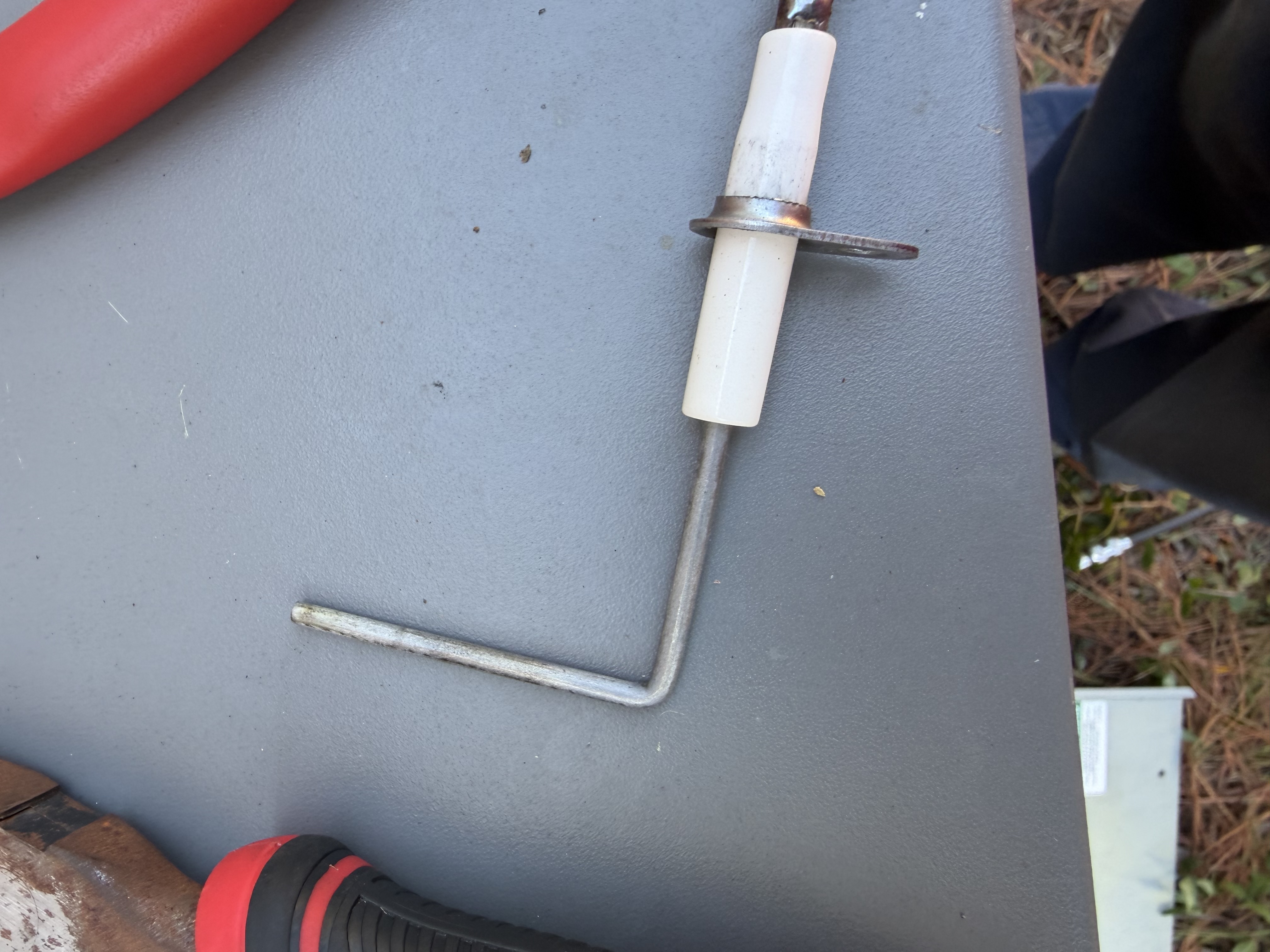 Performed heat maintenance on Rheem Package Unit. Picture of heat exchanger and cleaned flame sensor. 