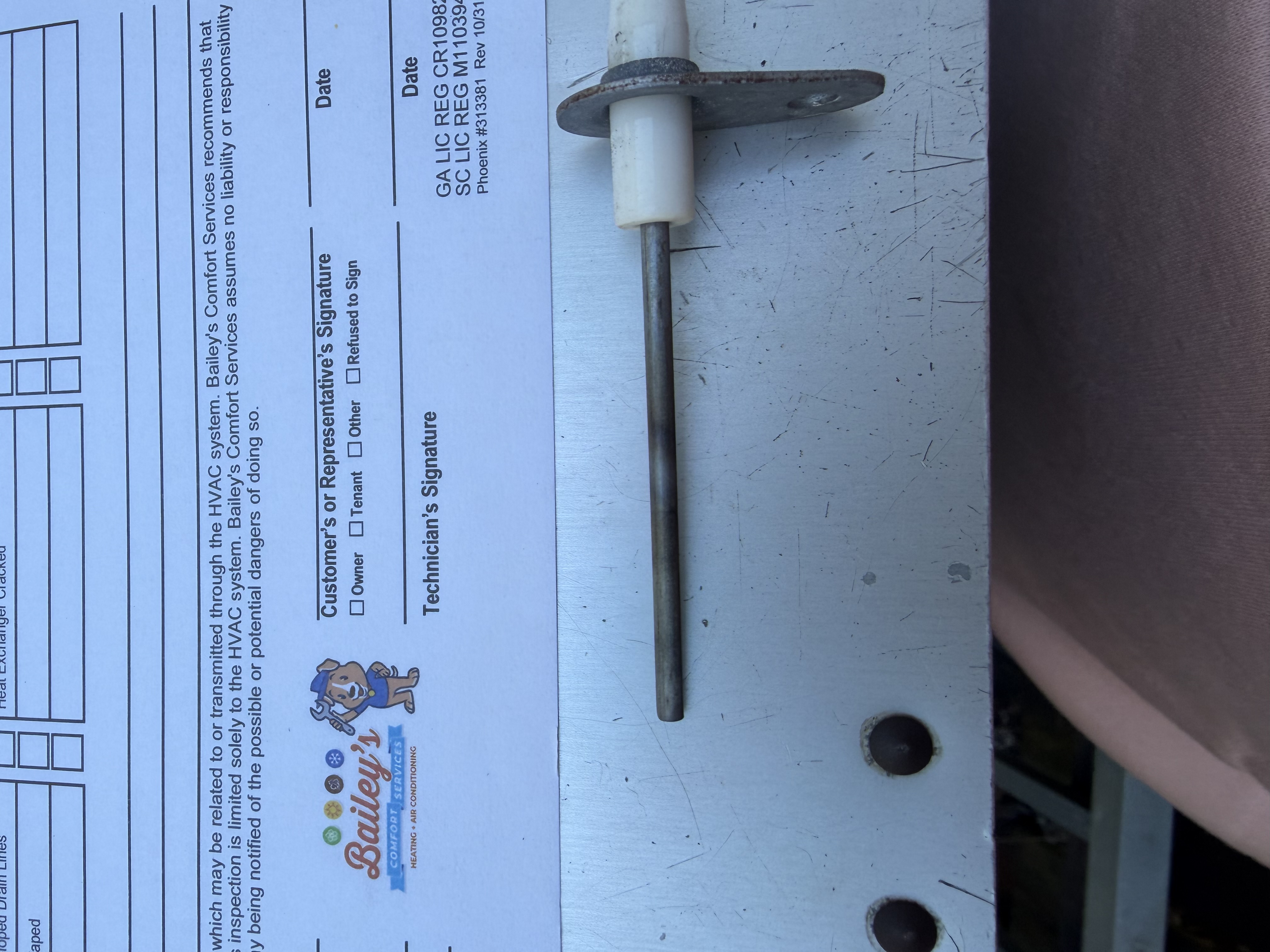 Heating maintenance on a goodman furnace. Picture of heat exchanger and cleaned flame sensor. 