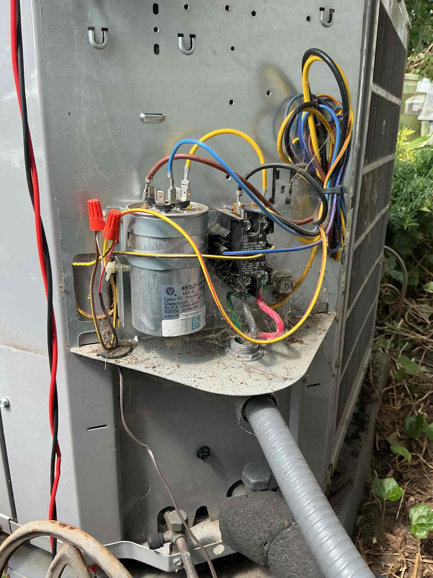 Found compressor and fan not to be running upon arrival due to a failed capacitor, and a failing contactor. Installed new turbo capacitor and a new contactor, condenser coil was plugged, cleaned coil with hose, tested system, system is working properly at this time.