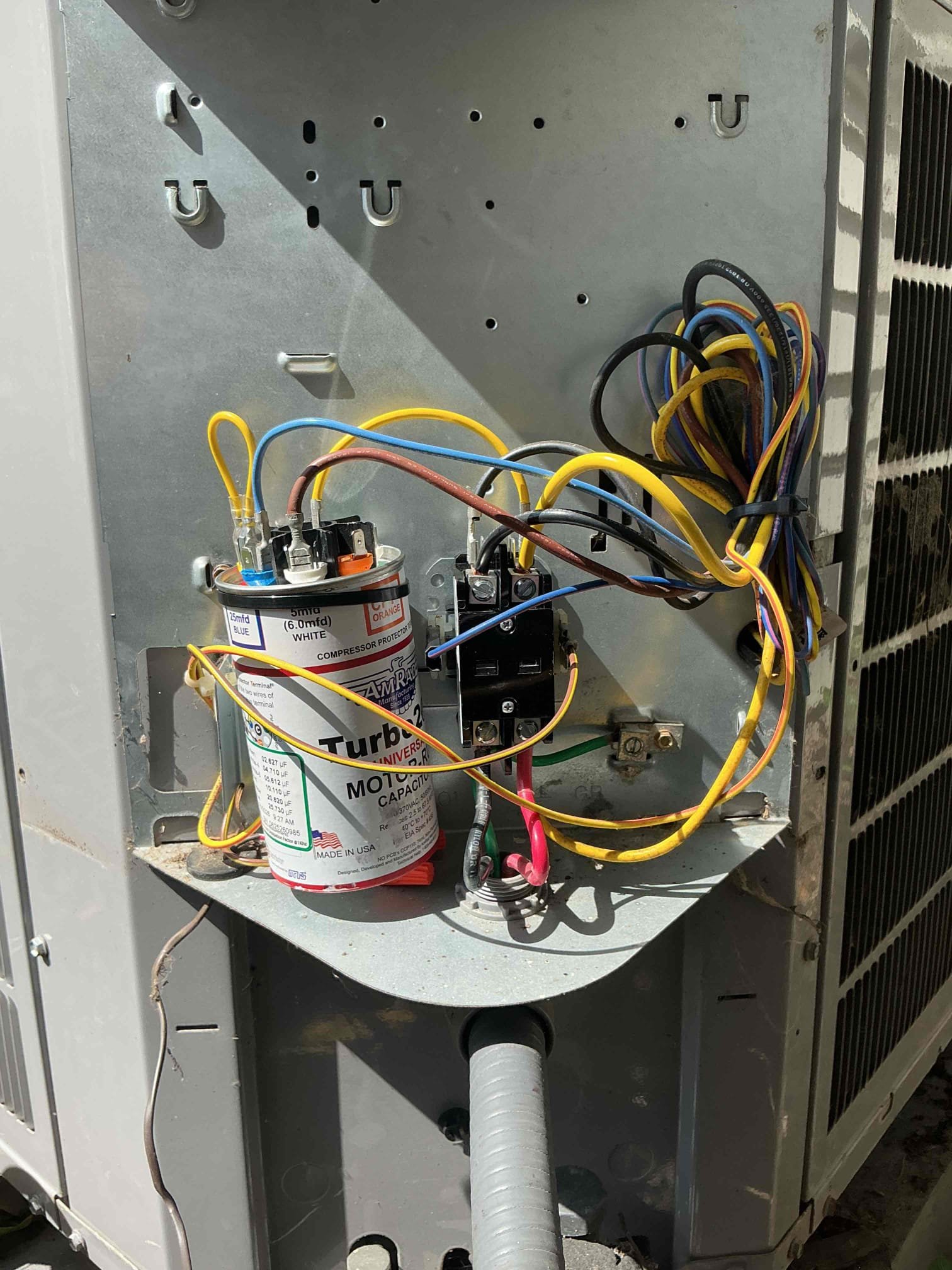 Found compressor and fan not to be running upon arrival due to a failed capacitor, and a failing contactor. Installed new turbo capacitor and a new contactor, condenser coil was plugged, cleaned coil with hose, tested system, system is working properly at this time.