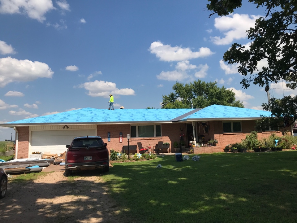 Perry, OK - Getting started on a new metal project. This roof was damaged by hail and the Home owners wanted to go back with something more impact resistant. So, we’re installing a metal R-panel in charcoal grey. Perry, OK - Getting started on a new metal project. This roof was damaged by hail and the Home owners wanted to go back with something more impact resistant. So, we’re installing a metal R-panel in charcoal grey.