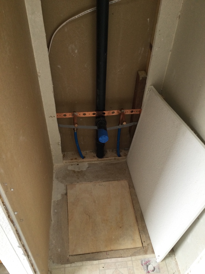 Installed rough plumbing for a new laundry sink installation.