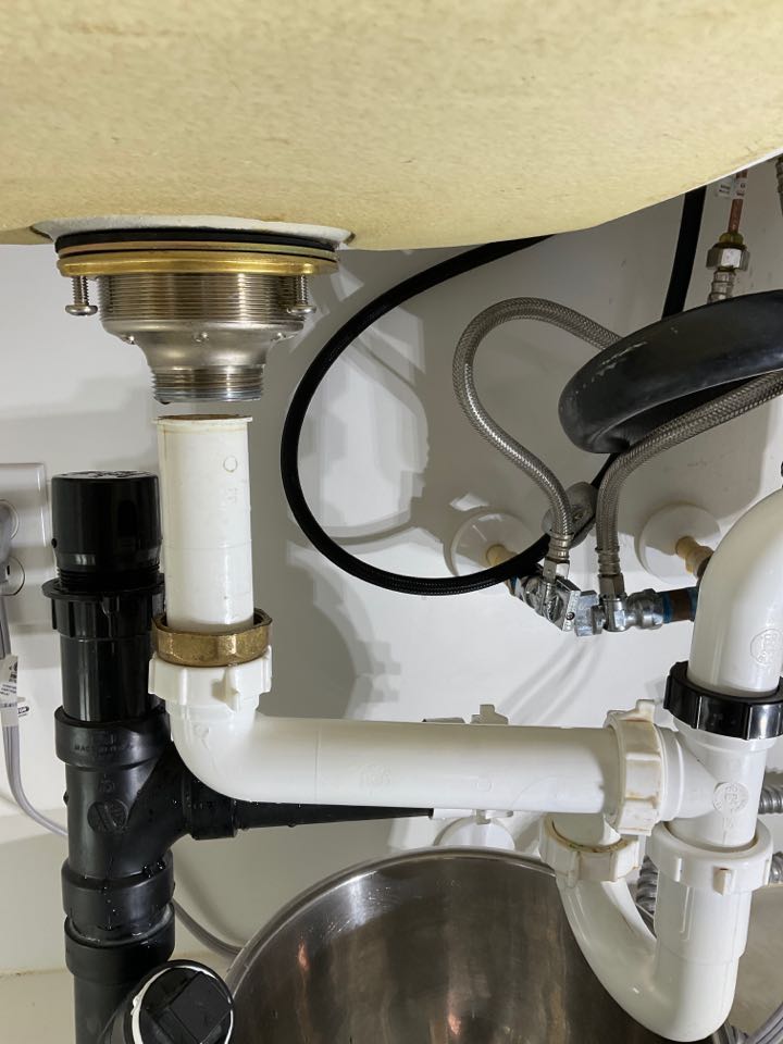 Aptos, CA - Repaired a leak under a kitchen sink. Aptos, CA - Repaired a leak under a kitchen sink.