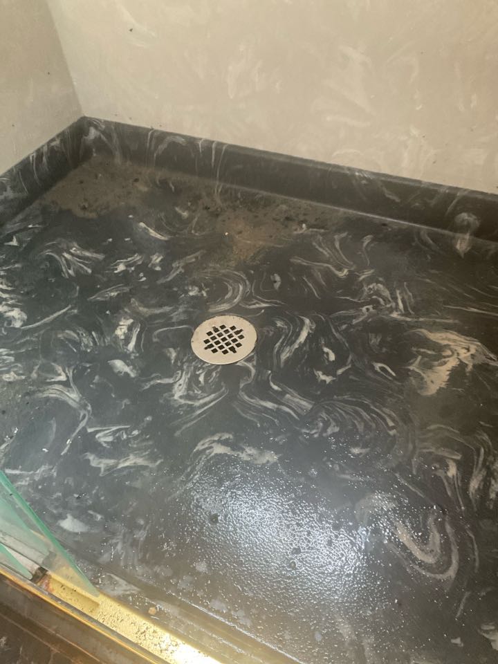 Cleared shower and kitchen drain.
